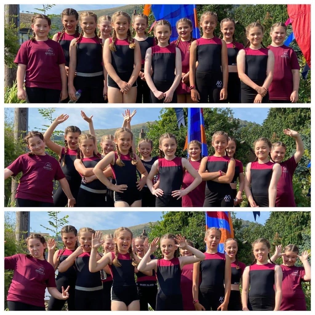 Burgundy costume team lined up before a performance