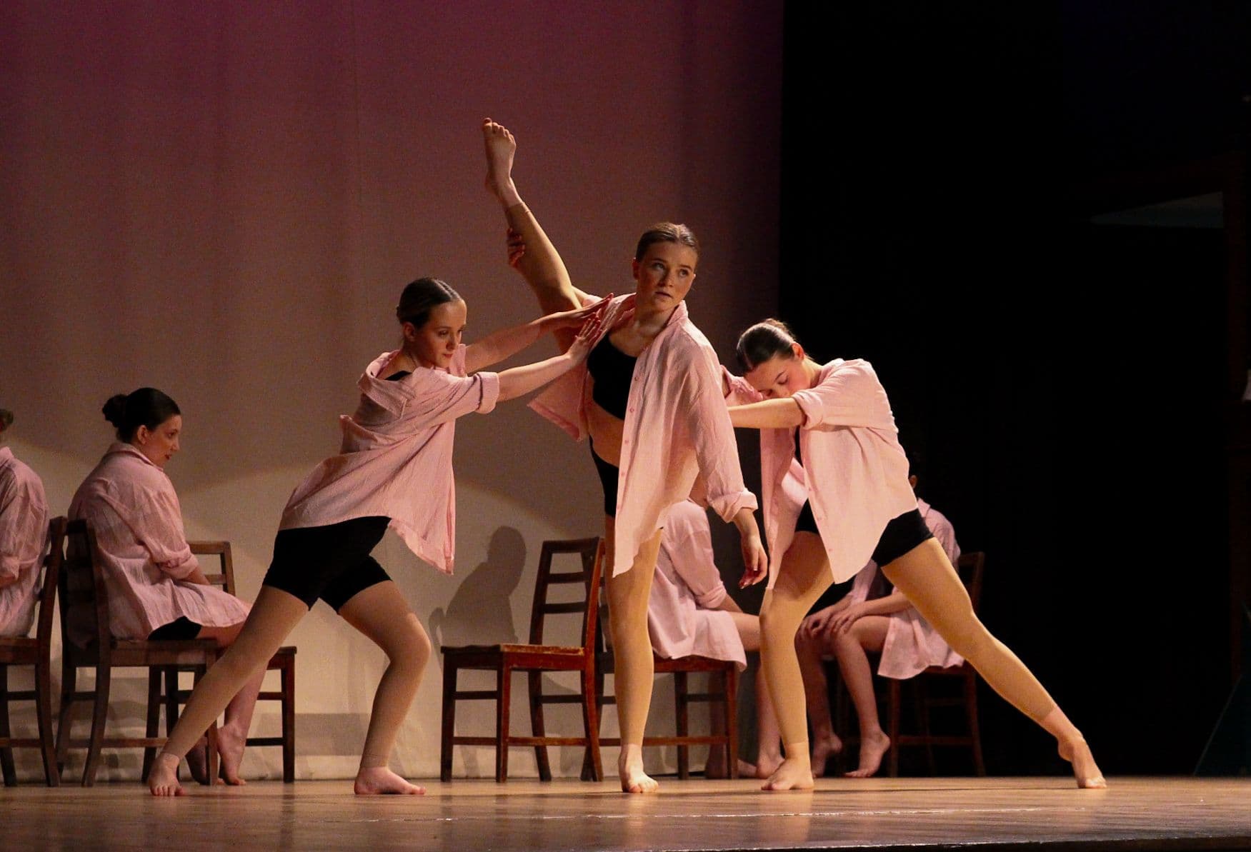 Amelia K Academy dancers performing on stage in a dynamic ensemble