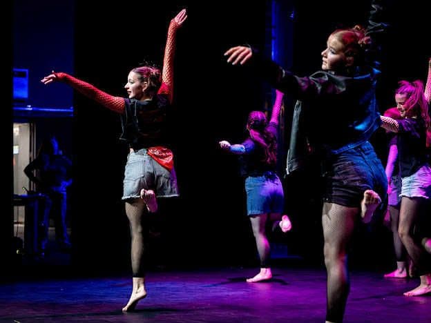 Amelia K Academy students in class and on stage
