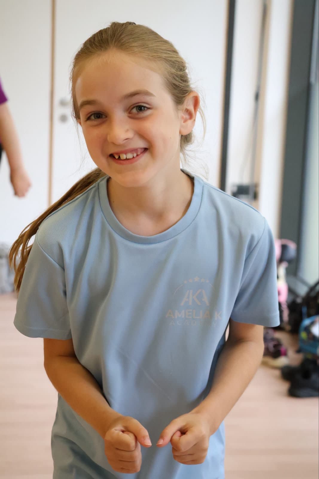 Amelia K Academy students in class and on stage