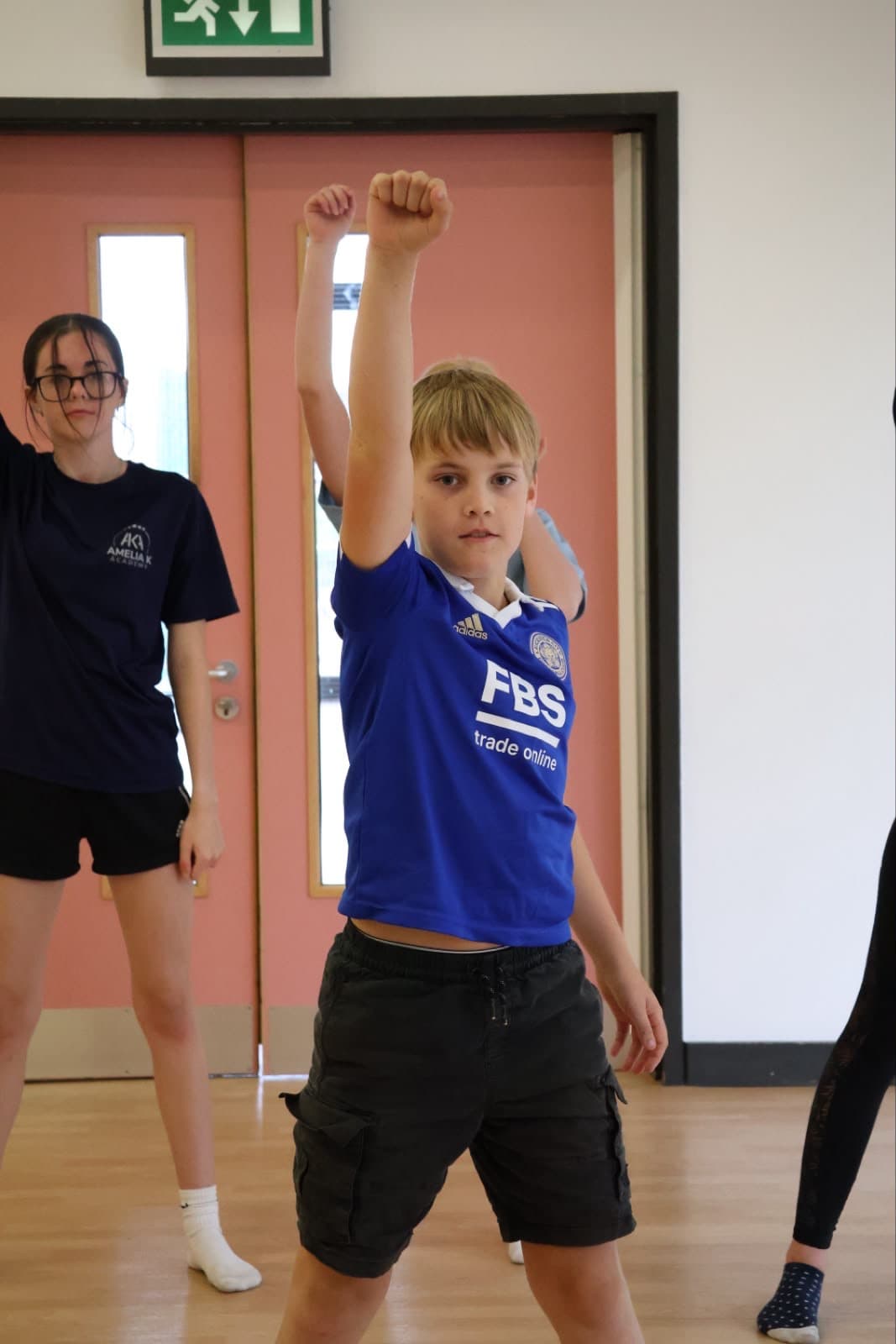 Amelia K Academy students in class and on stage