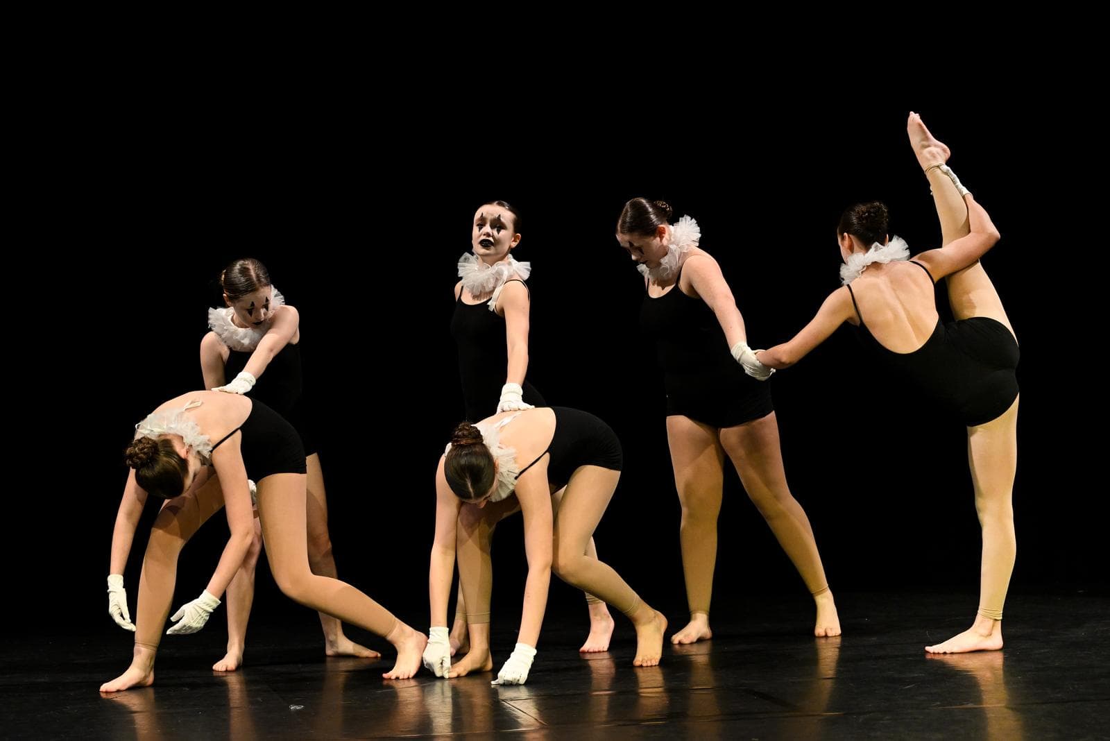 Company holding a low pose line during a number