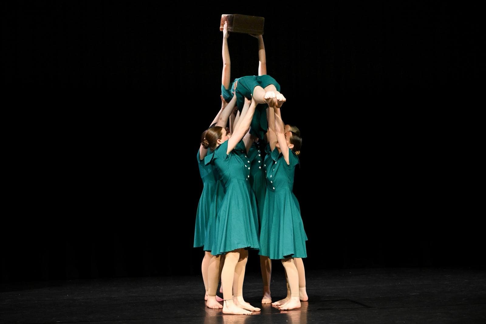 Summer school ensemble in acrobatic poses